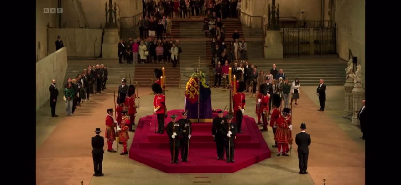 A Guard Standing Near The Queen’s Coffin Collapses