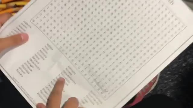 Little kid at desk mispronounces virginia on crossword puzzle