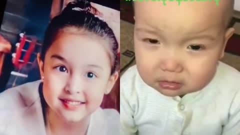 The baby is crying when he saw a cute baby girl pic wink his eyes.