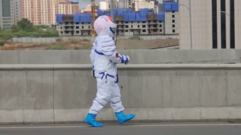 Cosmonaut walking on the City street😂