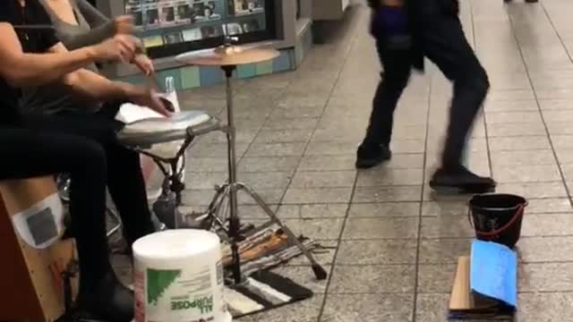 Subway drummers man white tank top wife beater dancing