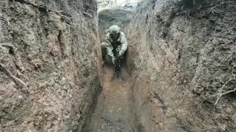 Ukrainian soldiers firing 40mm grenades from a 60mm mortar.