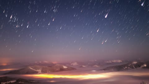 Starfall in the sky seen from the mountains