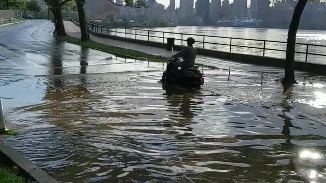 Delivery Driver Makes the Most of Flooded Street