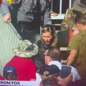 Corey Comperatore being taken off the bleachers