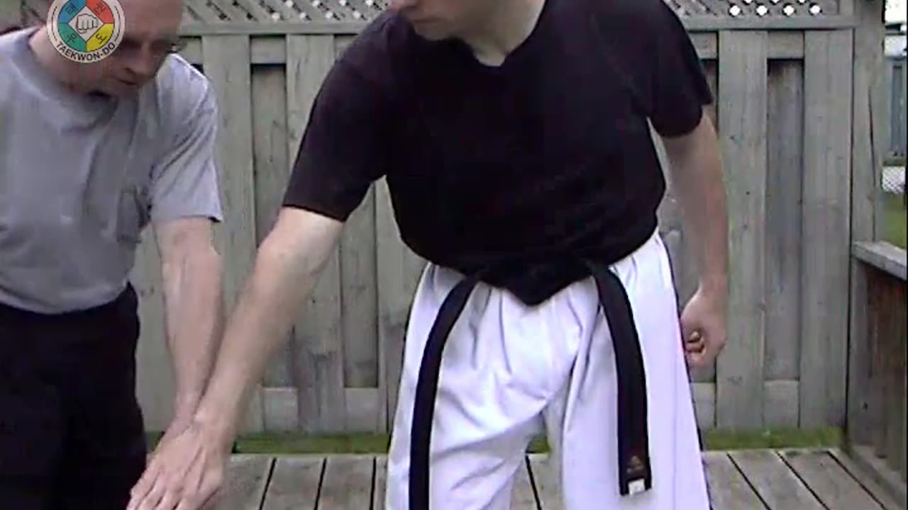 Baehr Taekwondo: white-belt-one-hand-holding-01-closeup