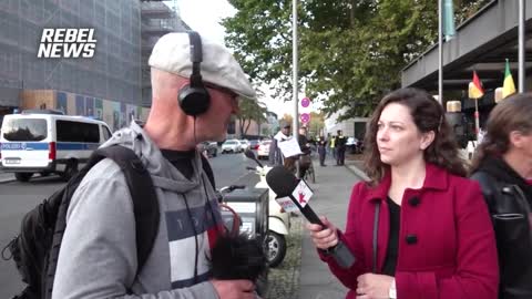 Protestors gather to denounce the World Health Organization ahead of Berlin health summit