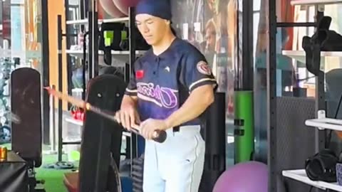 Japanese Baseball Player Doing Bat Tricks