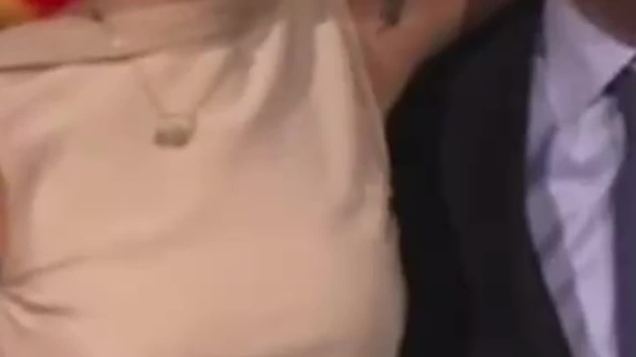 Ella Emhoff poses with father Doug Emhoff at DNC