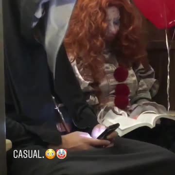 Couple two people subway dressed as nun and clown red balloons