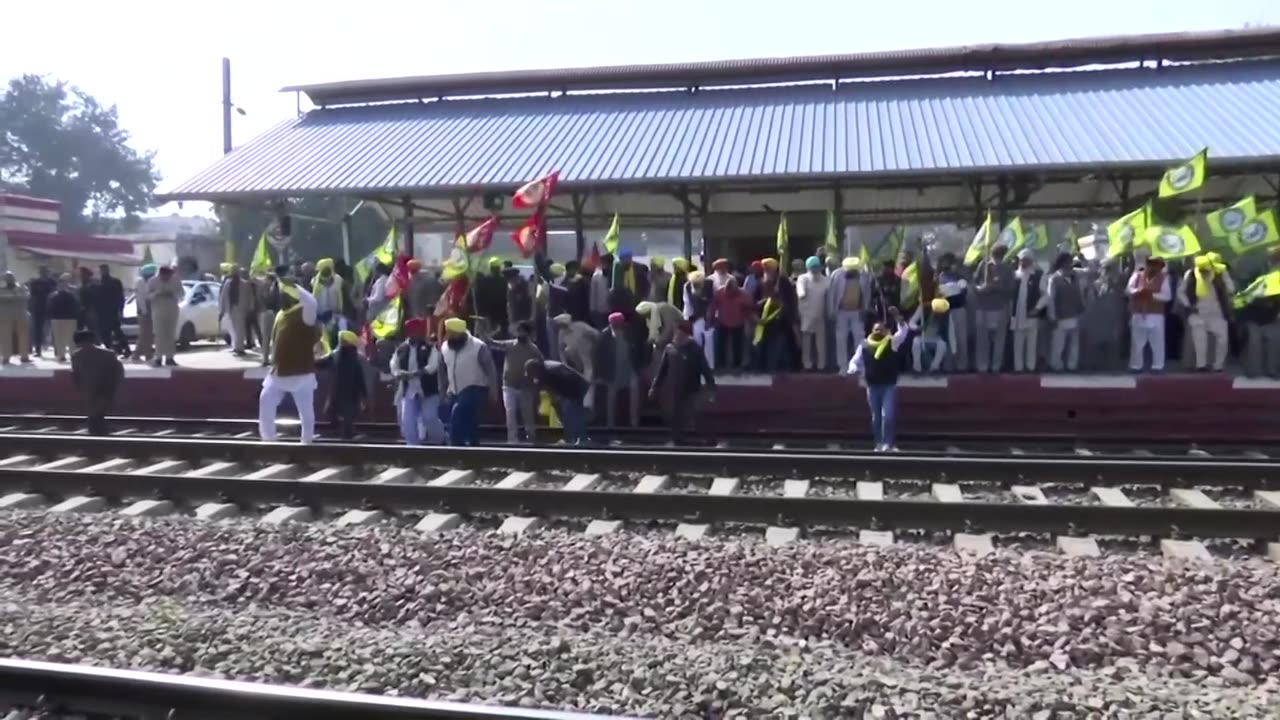 Protesting Indian farmers occupy railroad tracks