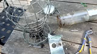 Man Frees Chipmunk Who Got Stuck In Bird Feeder