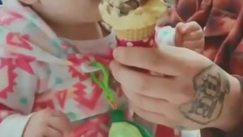 Baby's first taste of ice cream