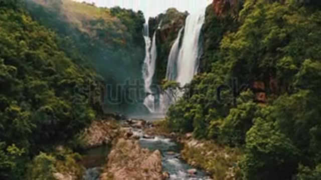 stock-footage-beautiful-waterfall-in-green-forest-top-view-tropical-in-mountain.mp4