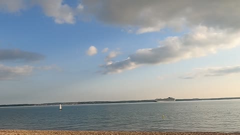 Calm waters . Beach . Sunny day