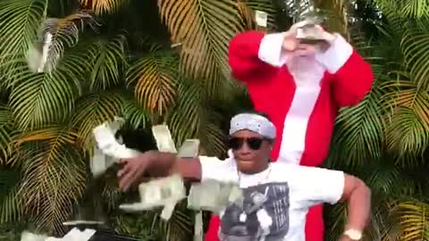 Man in white dances santa throws money