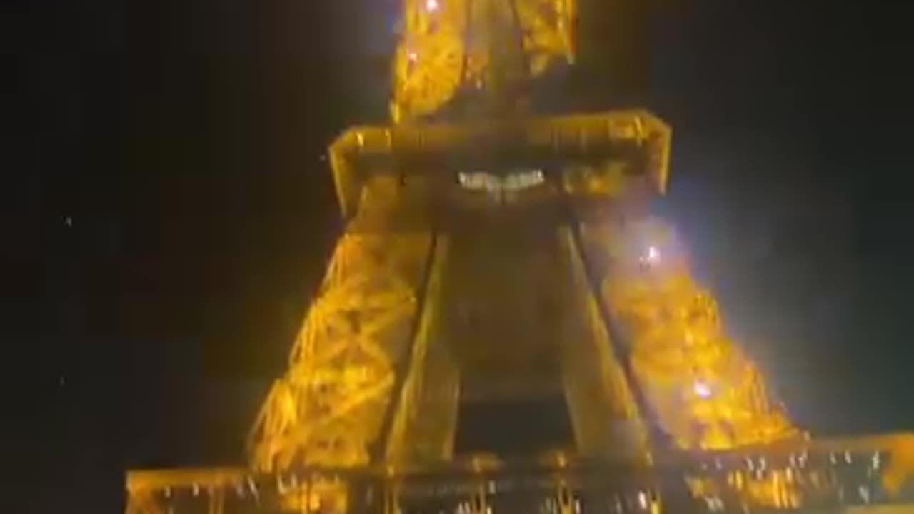 The Eiffel Tower with its beauty, covered with millions of lights
