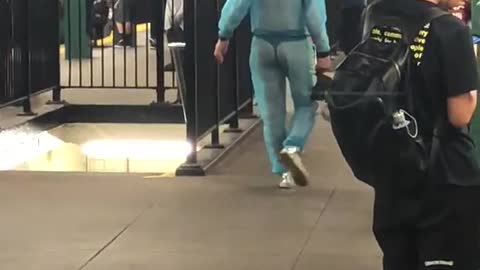 Guy subway station blue mesh see through clear jump suit outfit