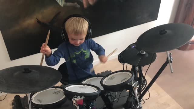 boy playing drums