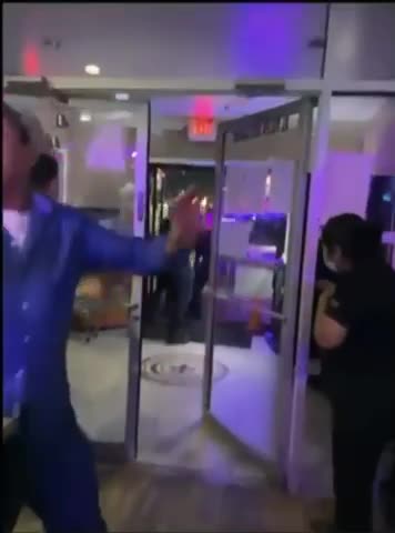 Female guard beats up people inside store in Asia.