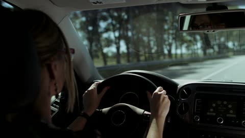 Woman driving on road