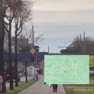 Train carrying trucks, self-propelled howitzers and AFVs passing through Orsha