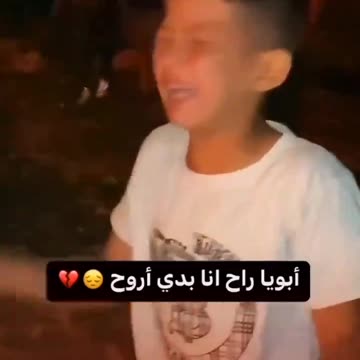 A child cries as his father is burnt alive in burning tents.