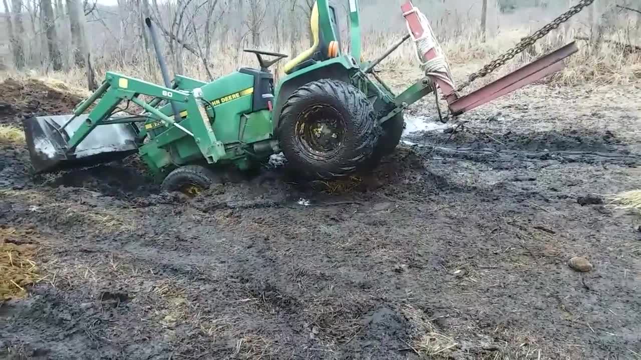 John Deere 670 Stuck in mud and pulled out by Oliver 1900