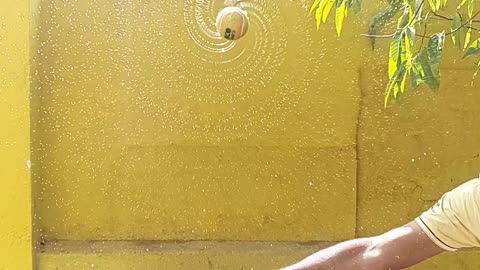 golden tennis ball in slow motion