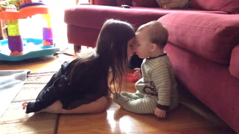 Big Sister And Baby Brother Share A Precious Moment 