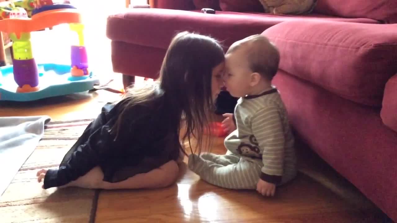 Big Sister And Baby Brother Share A Precious Moment