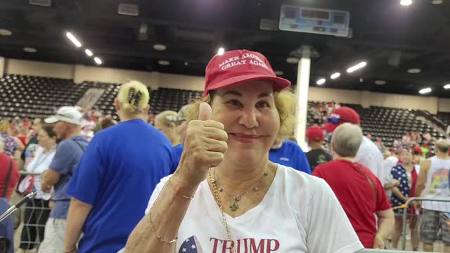 Happy woman say why she's at Trump rally