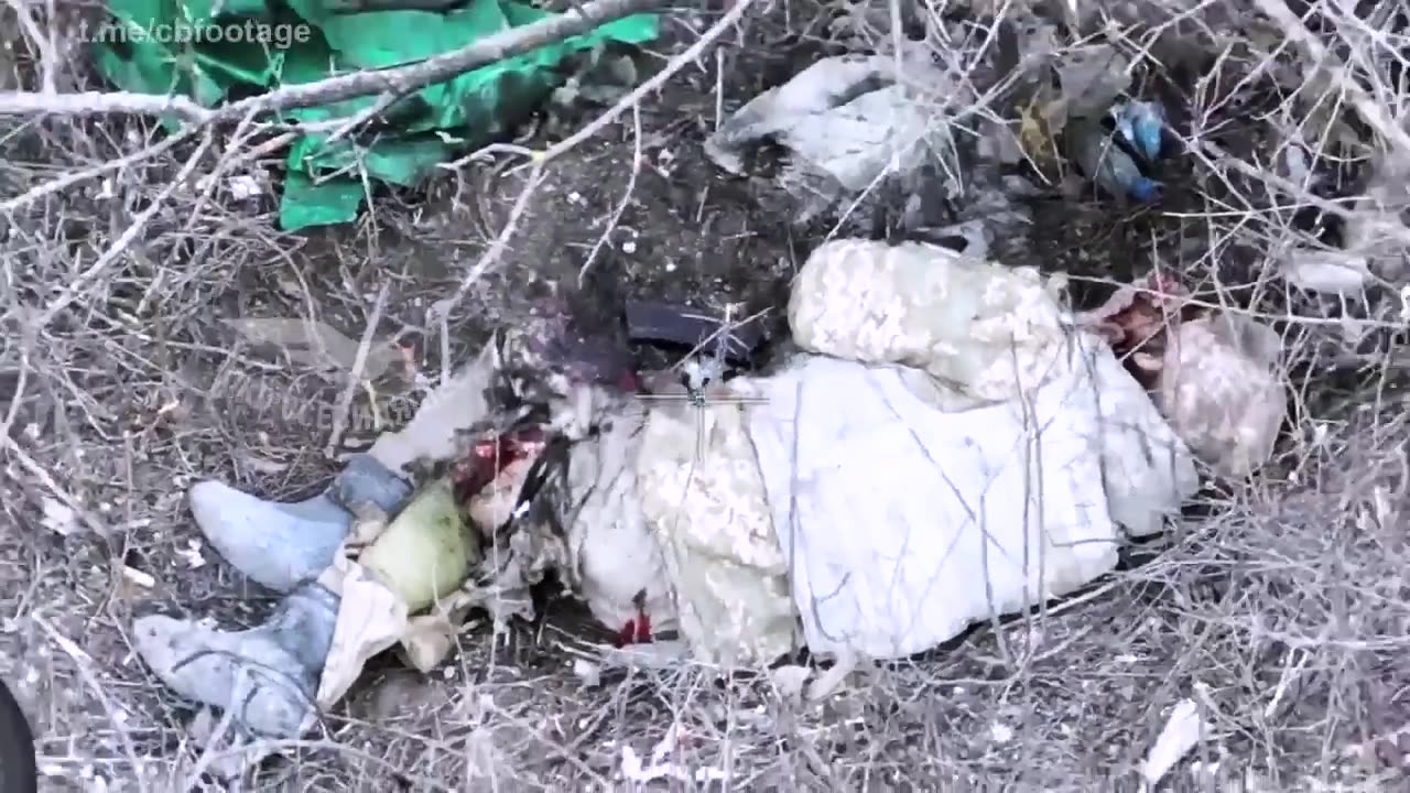 A russian drone droping on ukrainian soldiers with one losing his legs