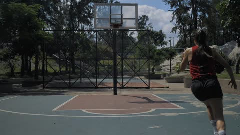 Man and woman passing basketball