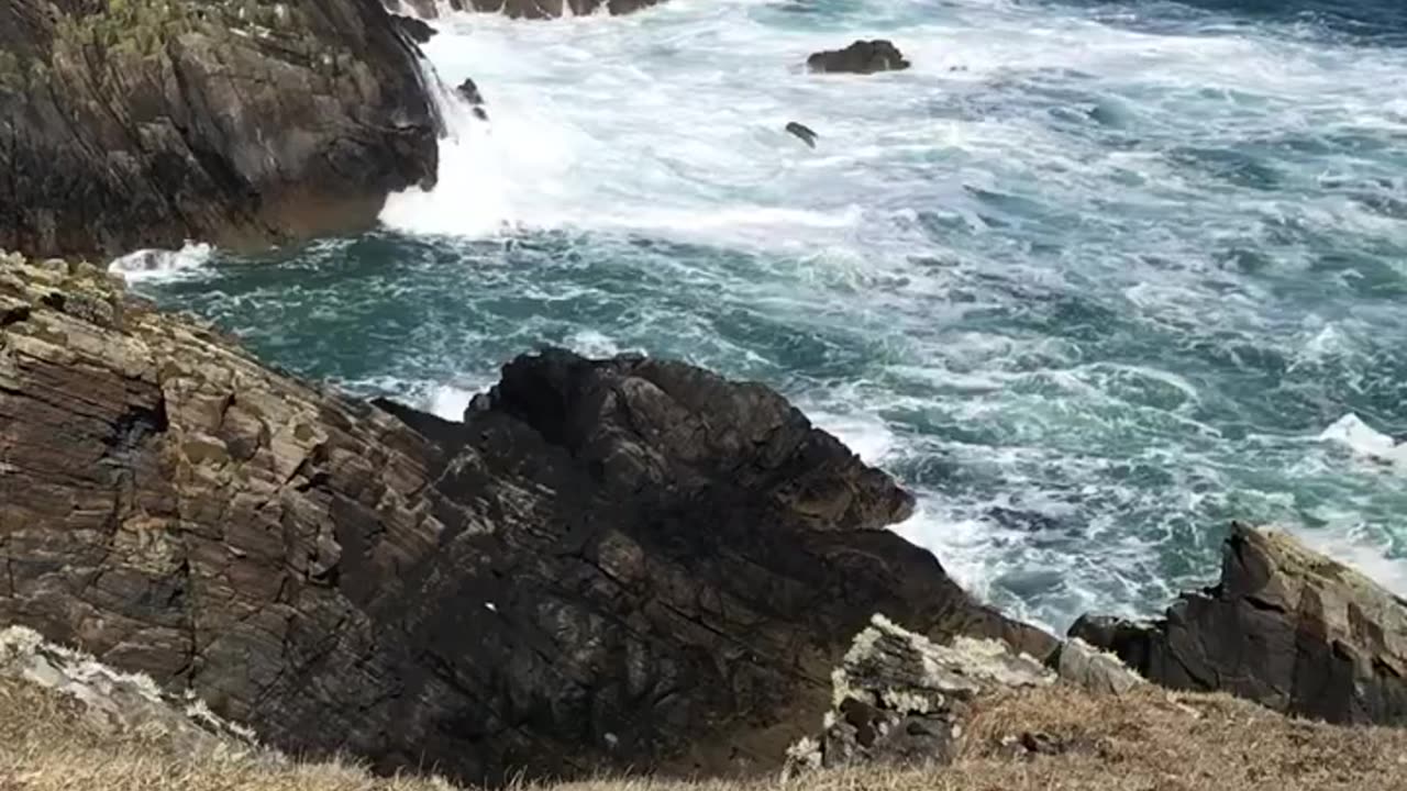 Feel peace on the edge of a cliff with wild Atlantic sea surging below