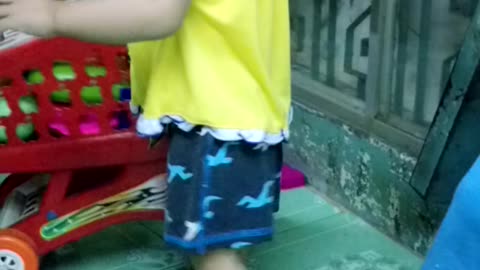 Baby is cleaning toys
