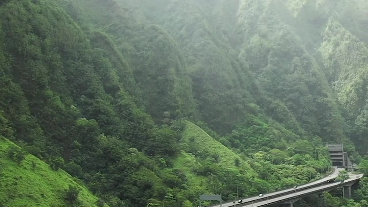 An Elevated Highway In The Mountain Valley In Hawaii