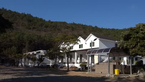 A pension or house in front of the beach