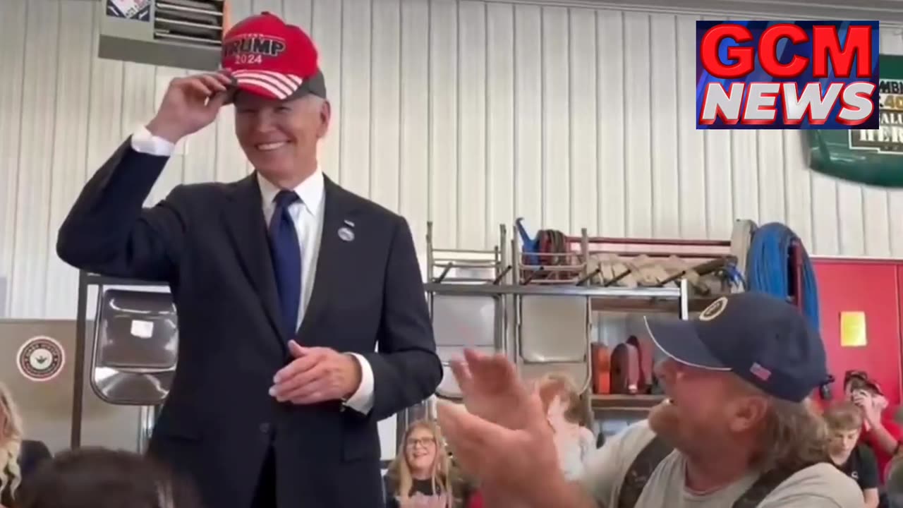 Biden wears Trump hat!