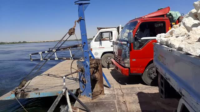 Trucks cross the Nile