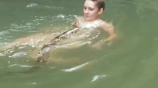 Woman Takes Pet Boa Constrictor For Swim