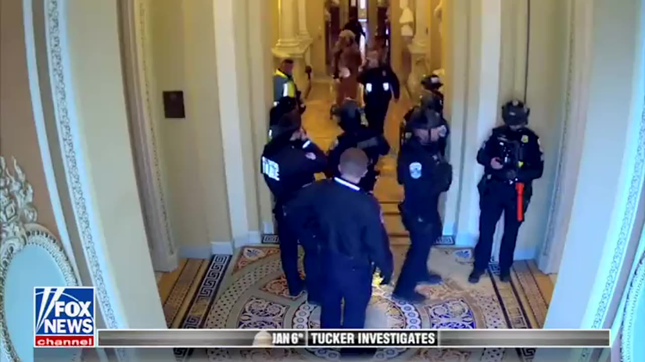 Never seen #j6footage shows Jacob Chansley being escorted through the Capitol by police.