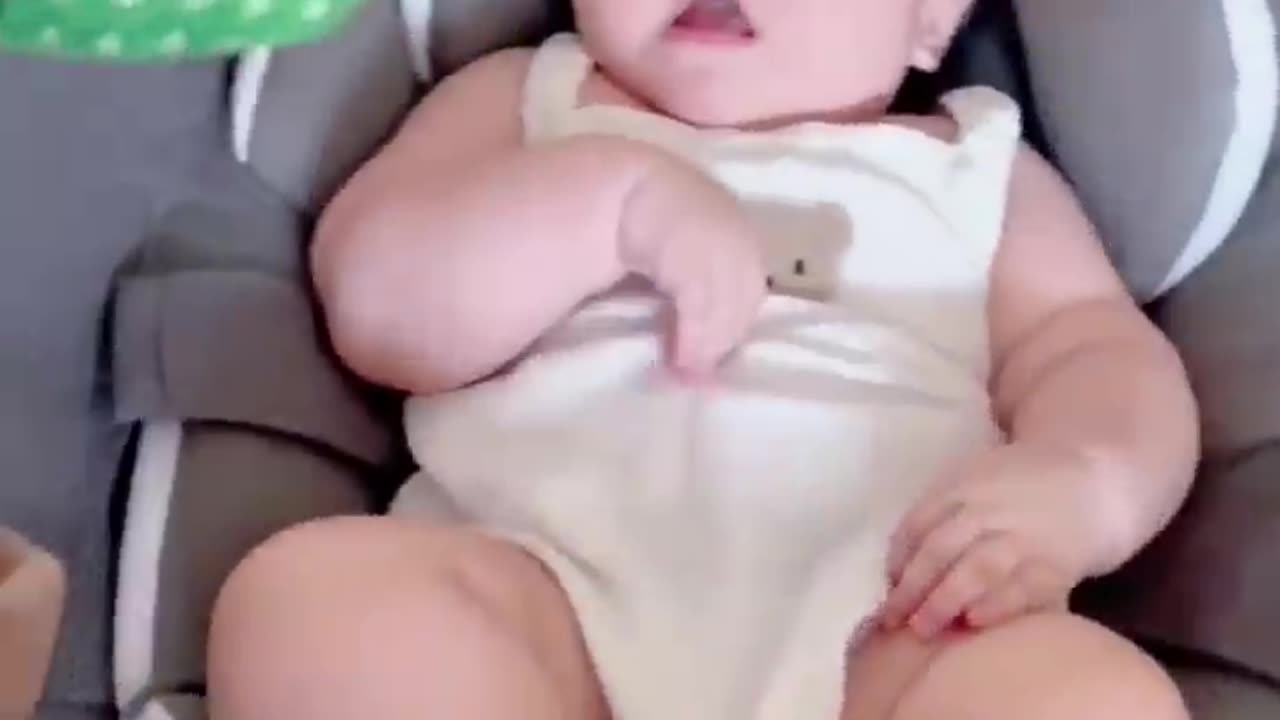 Babies play dancing cactus toy.