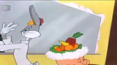 Bugs Bunny makes fruit salad on Elmer Fudds head