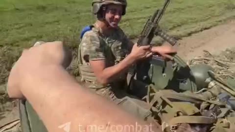 Ukrainian soldiers returning from the front with captured russians on top of a