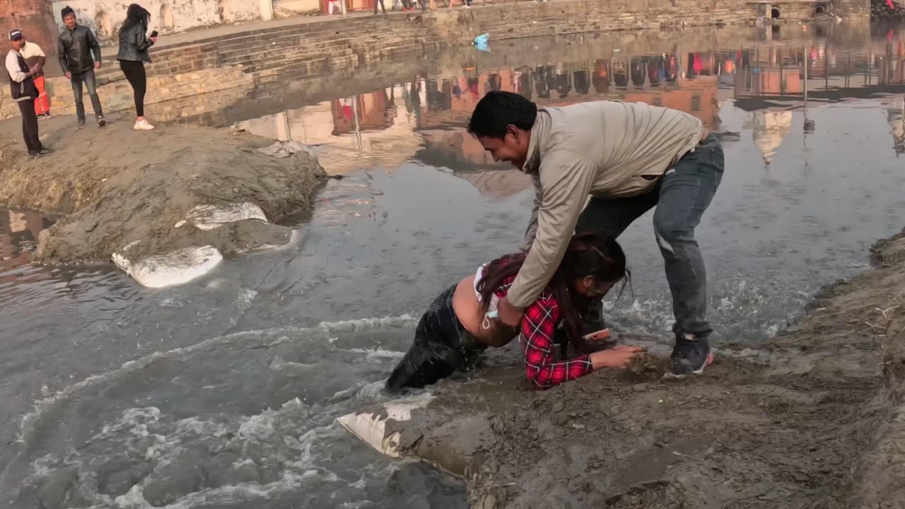 Woman Fails to Clear Jump Across Water