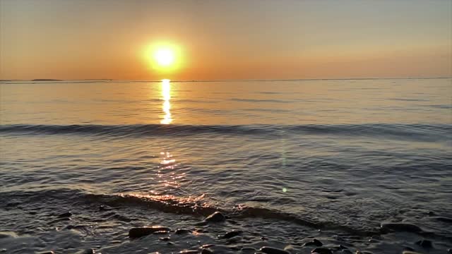 Girl playing on the shore enjoying the sunset - beautiful scenery - guess which country