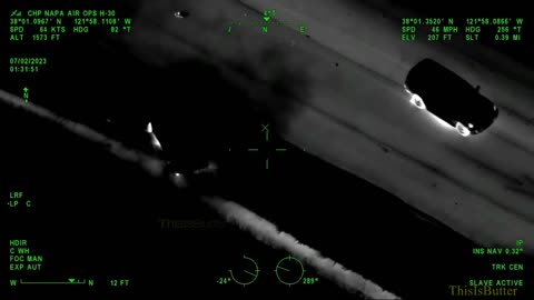 Sparks fly from suspect's car during police pursuit down highway in California