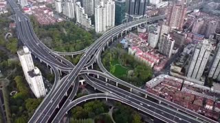 Drone shots show muted Shanghai as lockdown widens