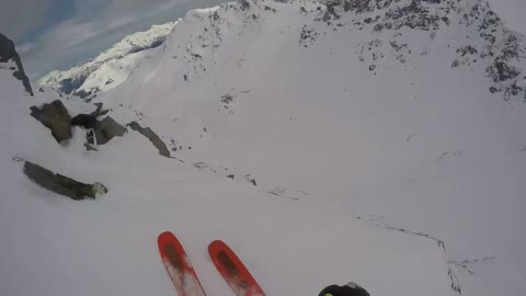 Person Stops Themselves From Falling Off Of Cliff While Skiing